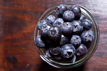 bowl of blueberries on rustic wooden table