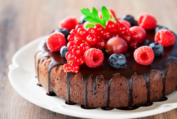 Chocolate cake with fresh berries, selective focus