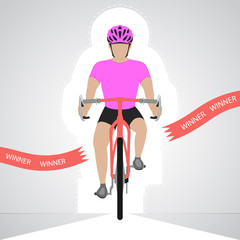 pink dressed cyclist in front view crossing red finish line