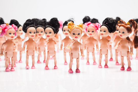 plastic dolls on white background