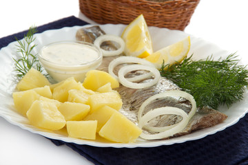 Dish with herring and potatoes