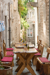 Fototapeta na wymiar Traditional sidewalk restaurant in Korcula, Croatia
