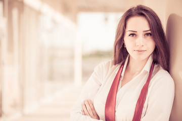 business woman portrait with red untided tie