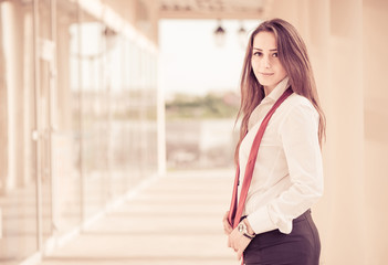 Fototapeta premium young woman in office clothes at city center