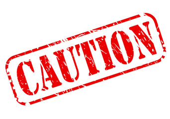 CAUTION red stamp text