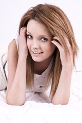 Naklejka premium beautiful young woman in bed