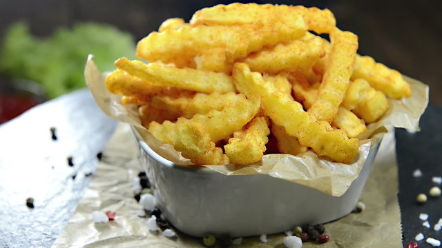 Portion of homemade French Fries (not loopable rotating video)