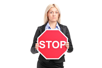 Businesswoman holding a stop sign