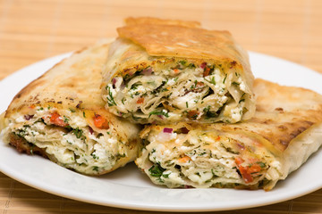 Pita bread wrapped with cottage cheese and vegetables