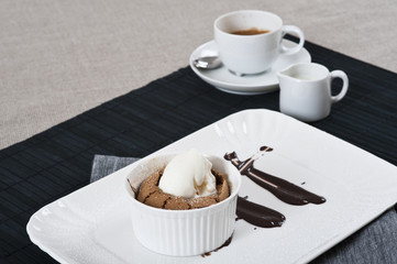 Chocolate flan with vanilla ice-cream and a cup of coffee