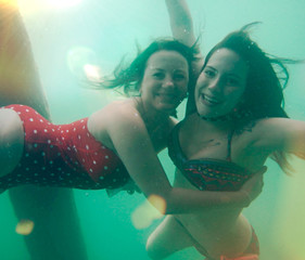 girls having fun underwater