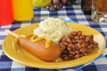 Corn dog with baked beans