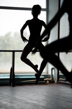 Two Ballet Dancers Doing Jumps