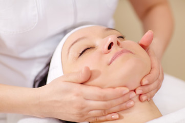 Fototapeta na wymiar Facial massage at beauty treatment salon