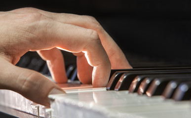 Fototapeta na wymiar Hand of a piano player