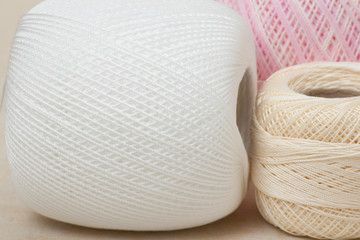 Threads Set On A Textile Background