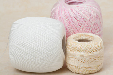 Threads Set On A Textile Background