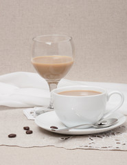 Cup Of Coffee and Irish Cream Liquor. Natural Linen Background