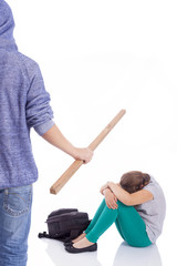 Boy beaten with wooden stick on a little girl, isolated on a whi