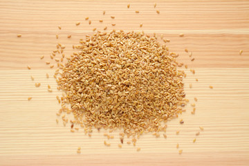 Golden linseed on wood