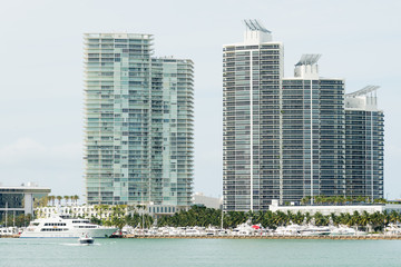 Modern residencial buildings on Miami Beach with yachts docked n