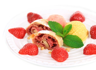 Tasty homemade strudel with ice-cream, fresh strawberry and