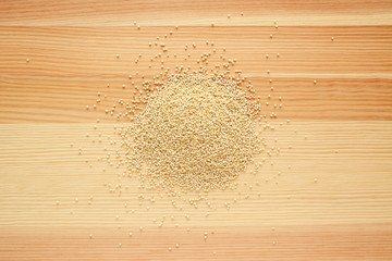 Quinoa grains on wood