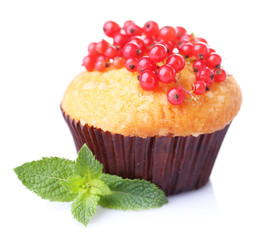 Tasty muffin with red currant isolated on white
