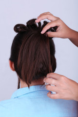 Fototapeta premium Creating hairstyles hairdresser close-up