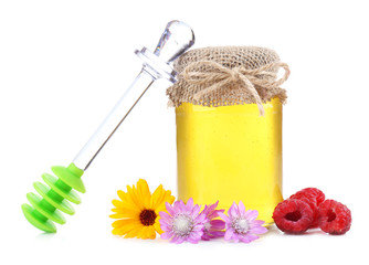 Jar full of delicious fresh honey and wild flowers, isolated