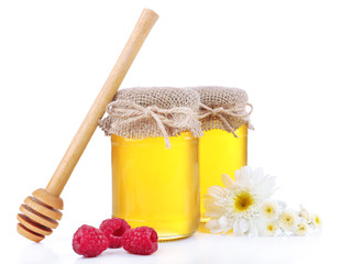 Jar full of delicious fresh honey and wild flowers, isolated