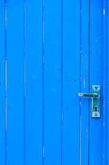 Blue colored wooden cottage door for background use