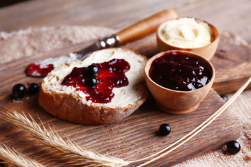 Fresh toast with homemade butter and blackcurrant jam