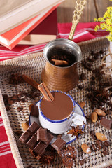Cup of hot chocolate on table, close up