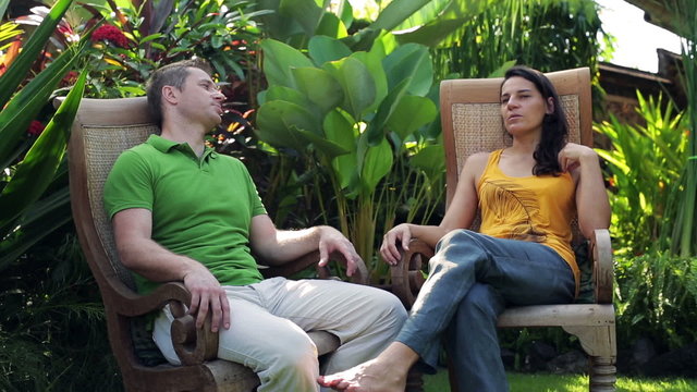 Couple chatting in garden and relaxing