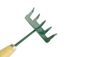 Small green harrow placed face with wooden handle isolated