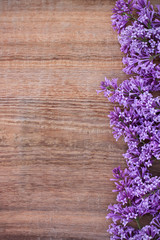 Lilac on an old wooden background