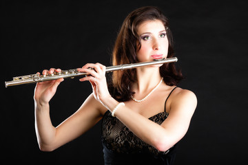 Art. Woman flutist flaustist musician playing flute © anetlanda
