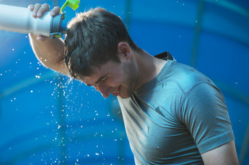 Athlete splashing pouring water head