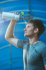 Athlete splashing pouring water head