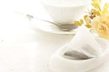 Fototapeta na wymiar Triangle tea pack on white background