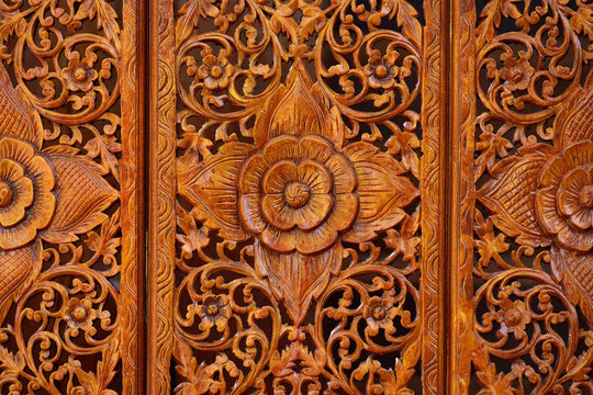 Pattern of flowers carved on wood