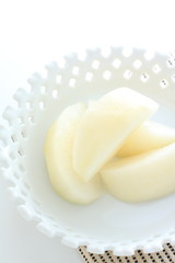 Peeled Japanese pear cut on dish