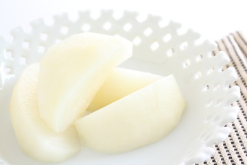 Peeled Japanese pear cut on dish