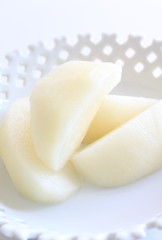 Peeled Japanese pear cut on dish