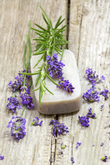 Obraz na płótnie Canvas bar of natural soap and lavender flowers