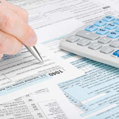 US Tax Form 1040 - man filling out tax form - 1 to 1 ratio