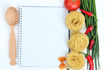 Cooking concept. Groceries with empty cookbook close up
