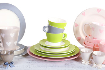 Different tableware on shelf, isolated on white