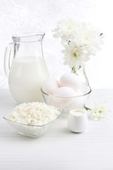 Tasty dairy products on wooden table